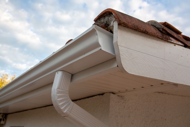 Completed gutter system with downspouts